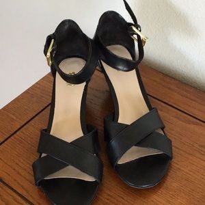 Fiona black low wedge ankle buckle sandals.